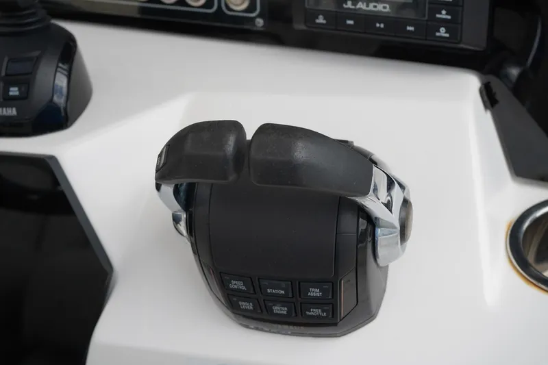 Slide: The Image of Throttle controls on a 2020 Sea Fox 328 Commander boat dashboard. - 41