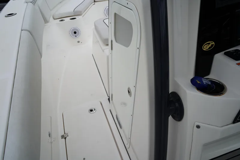 Slide: The Image of 2020 Sea Fox 328 Commander boat interior, featuring seating and storage compartments. - 47