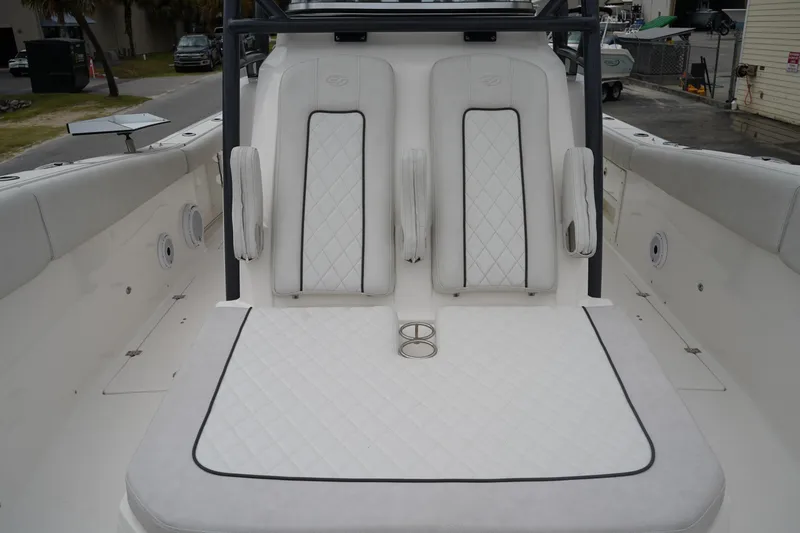Slide: The Image of 2020 Sea Fox 328 Commander boat interior with white cushioned seating. - 50