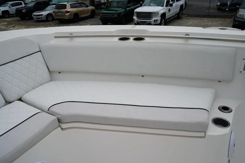 Slide: The Image of 2020 Sea Fox 328 Commander boat with white cushioned seating and cup holders. - 57