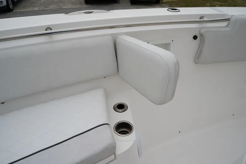 Slide: The Image of 2020 Sea Fox 328 Commander boat interior with white cushioned seating and cup holders. - 58