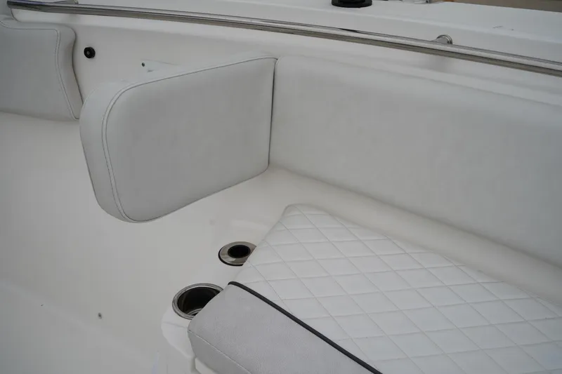 Slide: The Image of 2020 Sea Fox 328 Commander interior with white cushioned seating and cup holders. - 60