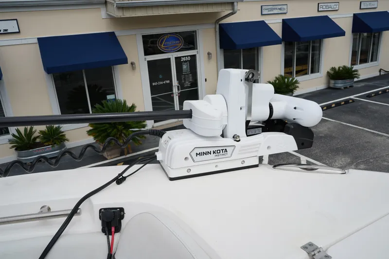 Slide: The Image of Minn Kota Instinct motor on 2020 Sea Fox 328 Commander boat, docked near a building. - 69