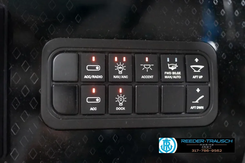 Slide: The Image of Control panel of a 2026 Bennington 22 ML boat with various switches. - 103