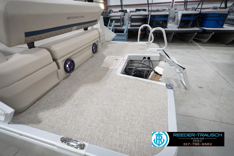 Slide: The Image of 2026 Bennington 22 ML pontoon boat interior with seating and storage compartment. - 119