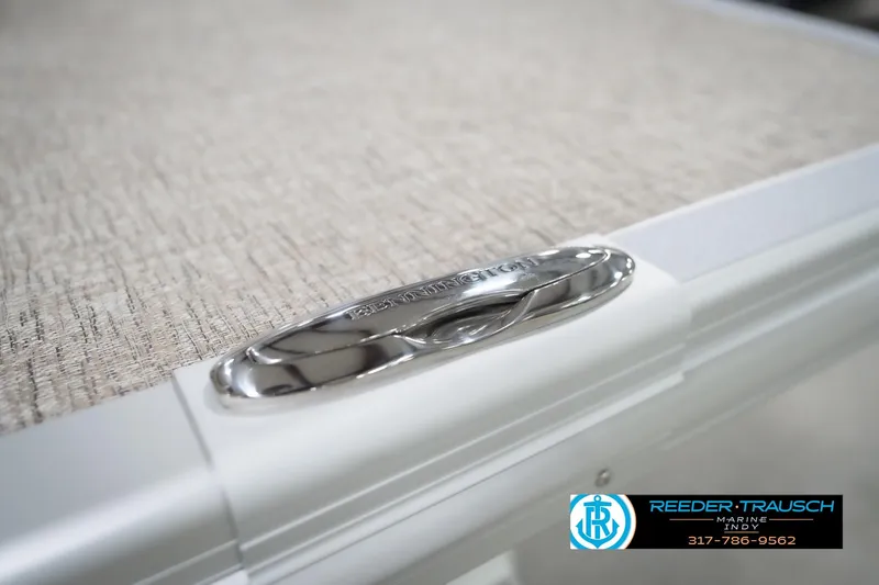 Slide: The Image of 2026 Bennington 22 ML boat detail with sleek chrome finish and textured surface. - 121