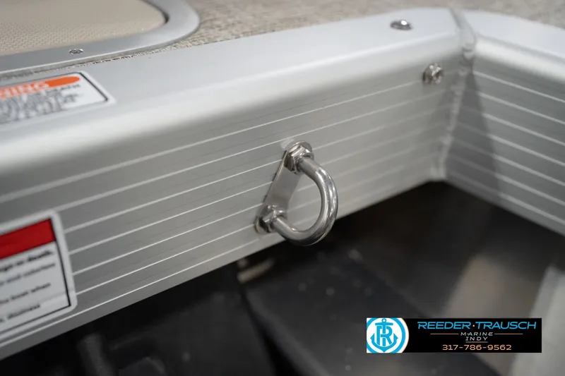 Slide: The Image of 2026 Bennington 22 ML boat detail with metal ring and Reeder Trausch Marine logo. - 123