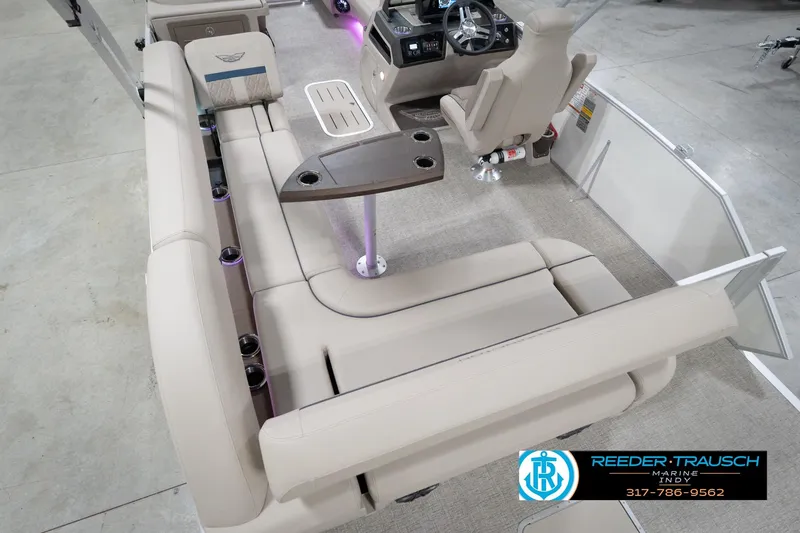 Slide: The Image of 2026 Bennington 22 ML boat interior with beige seating and steering console. - 76
