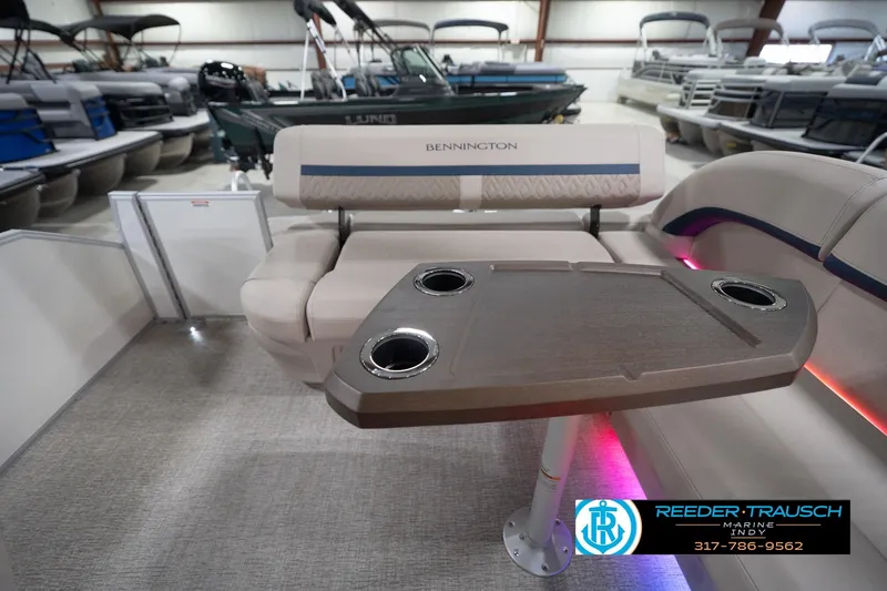 Slide: The Image of 2026 Bennington 22 ML pontoon boat interior with table and seating. - 79