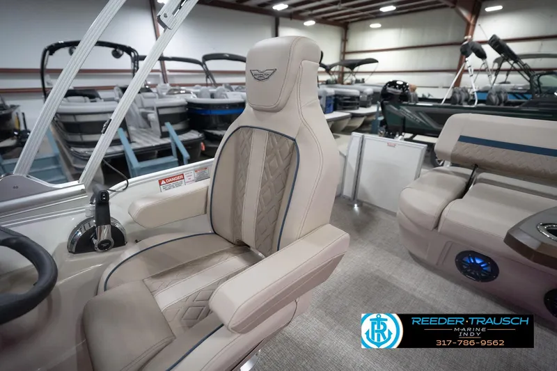 Slide: The Image of Luxurious interior of 2026 Bennington 22 ML pontoon boat in showroom setting. - 87