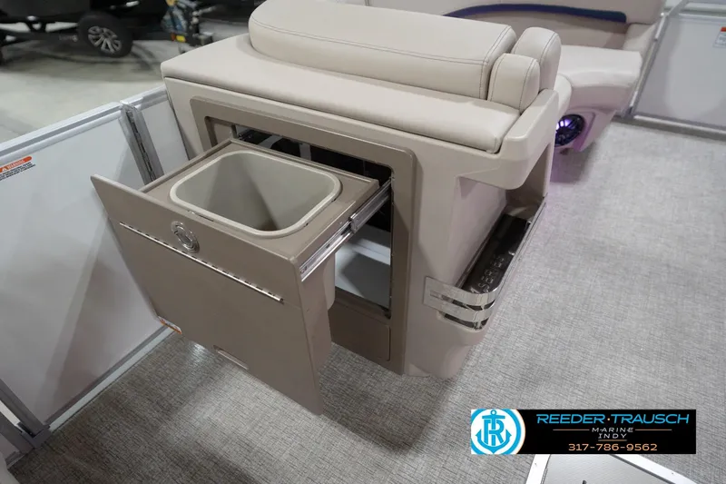 Slide: The Image of 2026 Bennington 22 ML boat interior with built-in storage compartment and seating. - 91