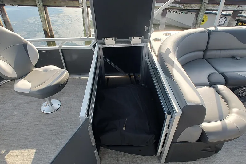 Slide: The Image of 2023 Tahoe Pontoon LTZ Rear Fish 22' interior with seating and storage. - 12