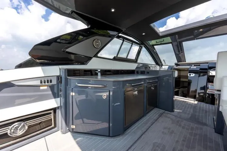 Slide: The Image of 2023 Cruisers 42 GLS OB yacht interior with sleek cabinetry and modern design. - 13