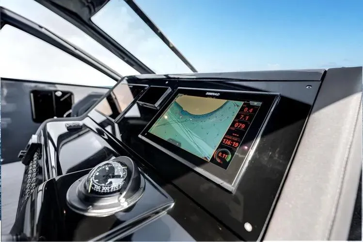 Slide: The Image of Helm of 2023 Cruisers 42 GLS OB with navigation display and compass. - 22