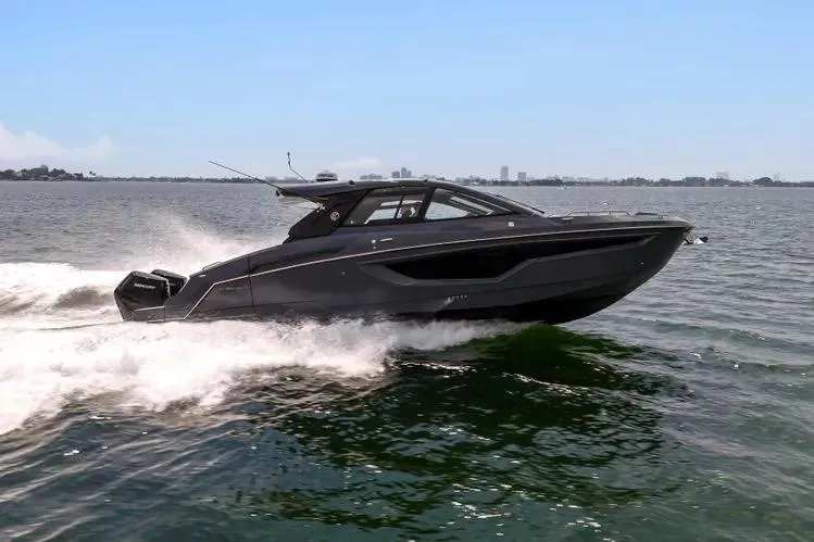 Slide: The Image of 2023 Cruisers 42 GLS OB yacht cruising on open water, sleek design, powerful performance. - 3