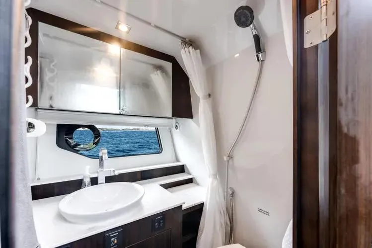 Slide: The Image of Luxurious bathroom interior of 2023 Cruisers 42 GLS OB yacht with modern fixtures. - 40
