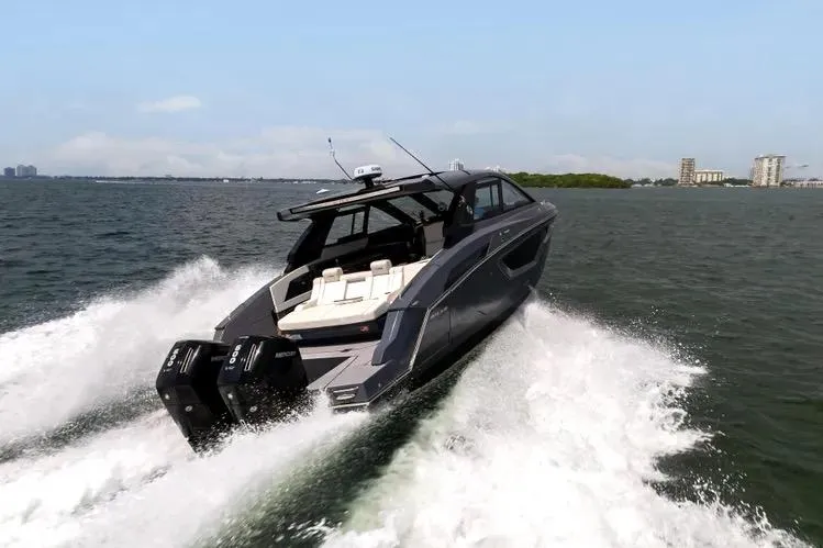 Slide: The Image of 2023 Cruisers 42 GLS OB yacht speeding on open water. - 5