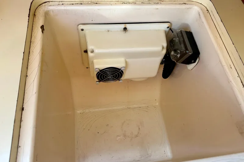 Slide: The Image of Interior view of a 1983 Sirena 38 compartment with cooling fan and motor. - 13