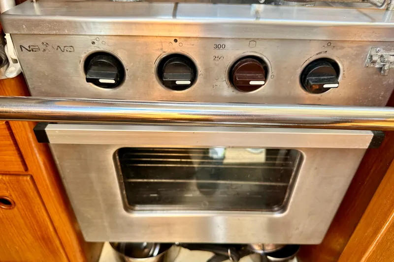 Slide: The Image of Stainless steel oven with control knobs on a Sirena 38, 1983 model yacht. - 14