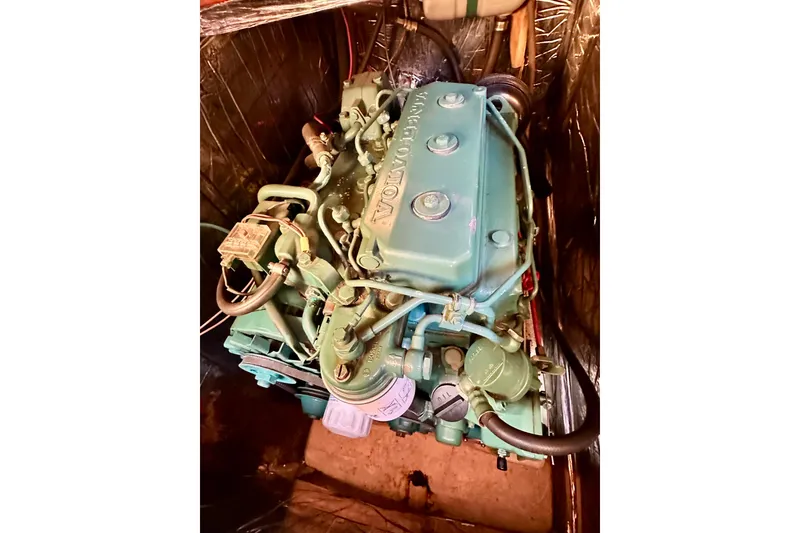 Slide: The Image of Engine of 1983 Sirena 38 boat, featuring a Volvo Penta motor. - 15