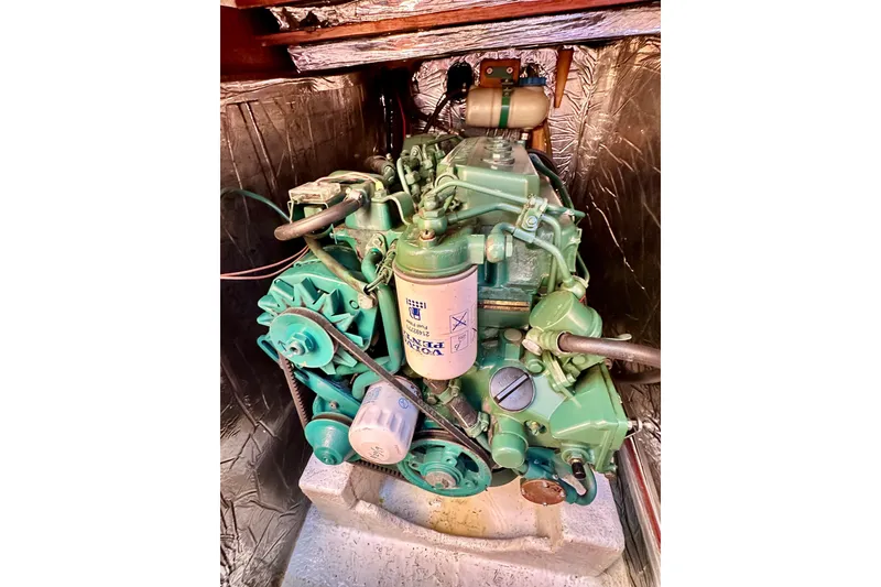 Slide: The Image of Engine compartment of a 1983 Sirena 38 boat, showcasing mechanical components. - 16