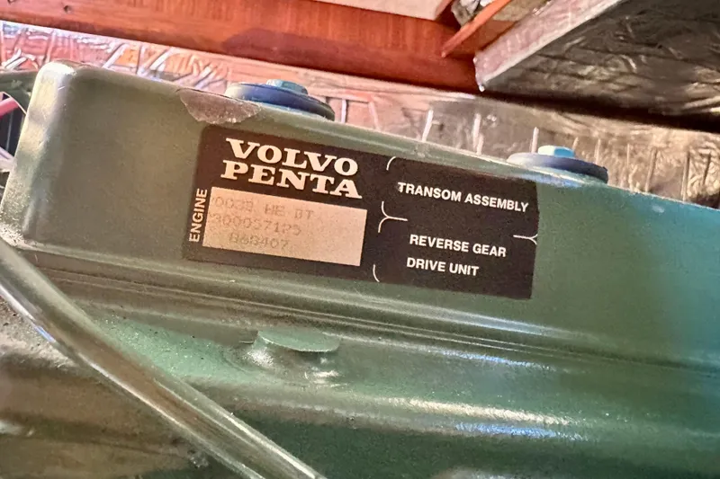 Slide: The Image of Volvo Penta engine label on a 1983 Sirena 38 boat, showing transom assembly details. - 17