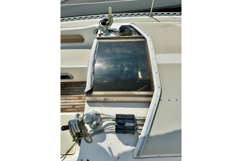 Slide: The Image of Deck view of 1983 Sirena 38 sailboat with ropes and hatch. - 30