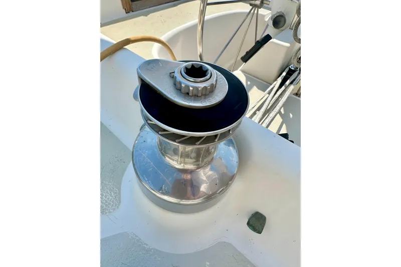 Slide: The Image of Winch on 1983 Sirena 38 sailboat deck, used for sail handling. - 32