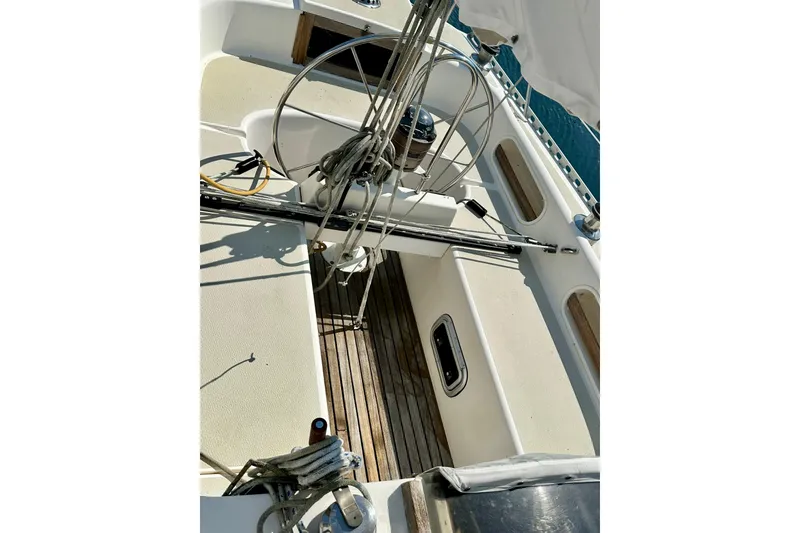 Slide: The Image of Cockpit of 1983 Sirena 38 sailboat with steering wheel and ropes. - 4