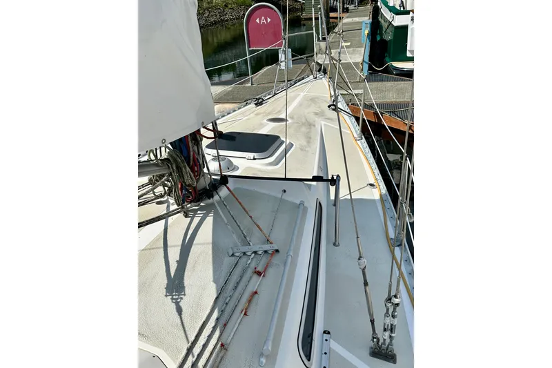 Slide: The Image of Deck view of 1983 Sirena 38 sailboat, showing rigging and mooring details. - 5