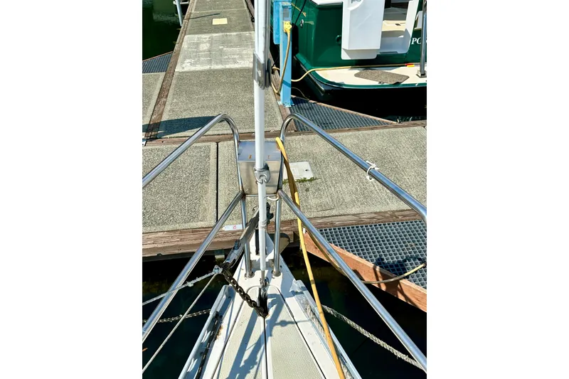 Slide: The Image of Bow of 1983 Sirena 38 sailboat docked at marina, showing deck and railing. - 6