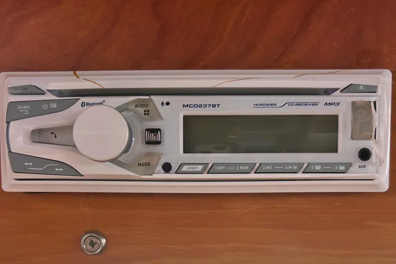 Slide: The Image of Bluetooth-enabled CD receiver on 1988 CHB Ponderosa Motor Yacht dashboard. - 10