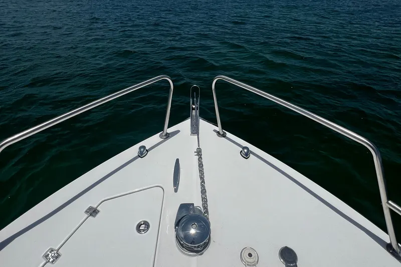 Slide: The Image of Bow of 2024 Yamane Center Consoles boat on open water. - 9