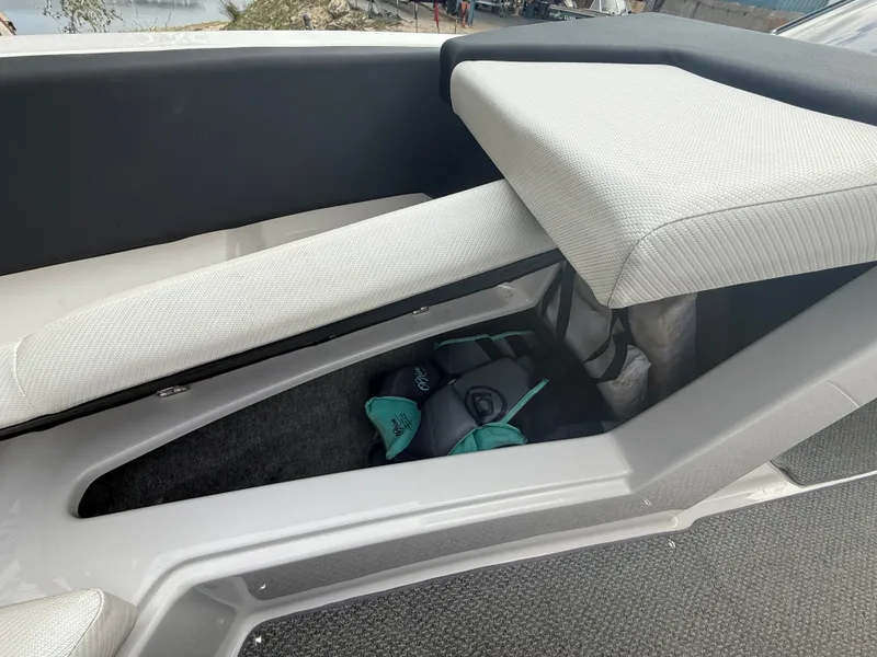 Slide: The Image of Interior of a 2013 Four Winns H210 boat with storage space. - 11