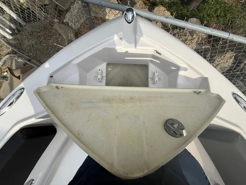 Slide: The Image of Front view of a 2013 Four Winns H210 boat deck. - 12