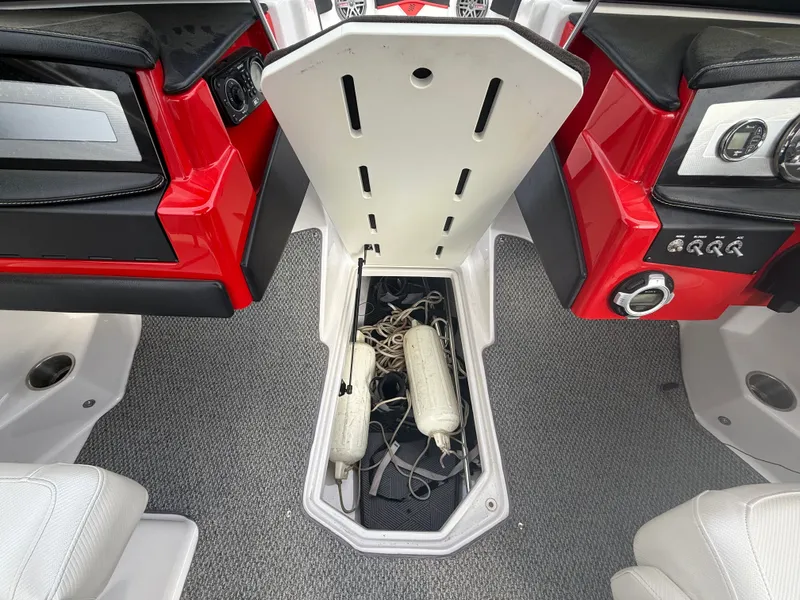 Slide: The Image of Interior of a 2013 Four Winns H210 boat with storage compartment. - 13