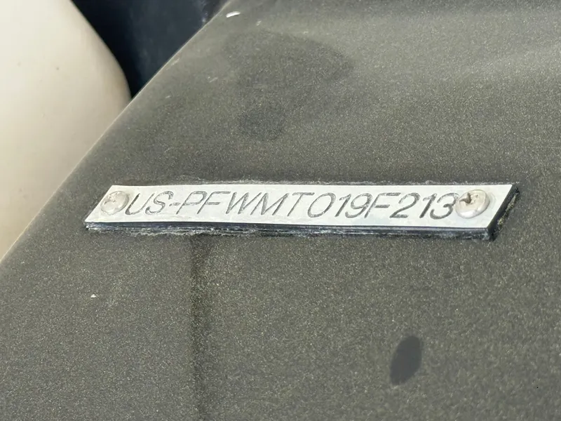 Slide: The Image of Serial number plate of a 2013 Four Winns H210 boat. - 16