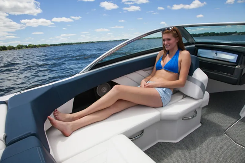 Slide: The Image of Woman relaxing on a 2013 Four Winns H210 boat on a sunny day. - 4