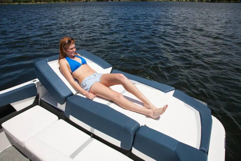 Slide: The Image of Woman relaxing on a 2013 Four Winns H210 boat in the water. - 8