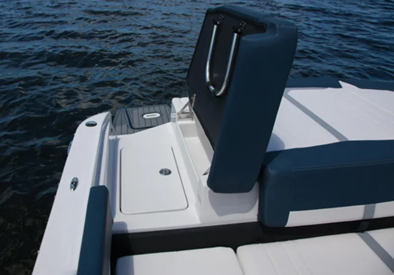 Slide: The Image of 2013 Four Winns H210 boat with open storage compartment on the deck. - 9