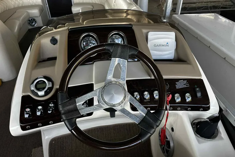 Slide: The Image of Steering console of 2014 Bennington 2875 QCW I/O boat with Garmin navigation system. - 10