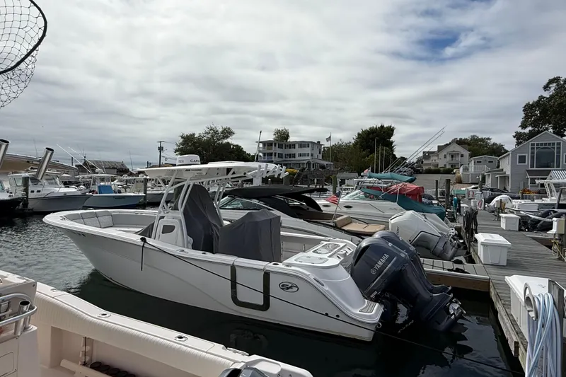 The Image of 2021 Sea Fox 288 Commander boat docked at a marina with Yamaha engines. - 0