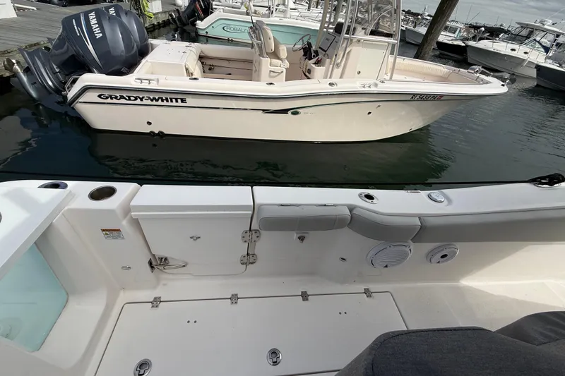 Slide: The Image of 2021 Sea Fox 288 Commander docked, with Grady-White boat nearby in marina. - 11