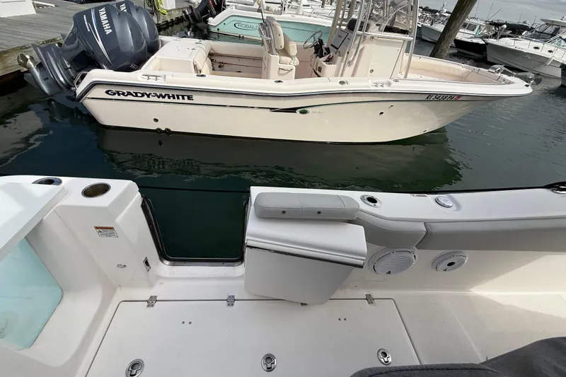 Slide: The Image of 2021 Sea Fox 288 Commander docked near Grady-White boat in marina. - 12