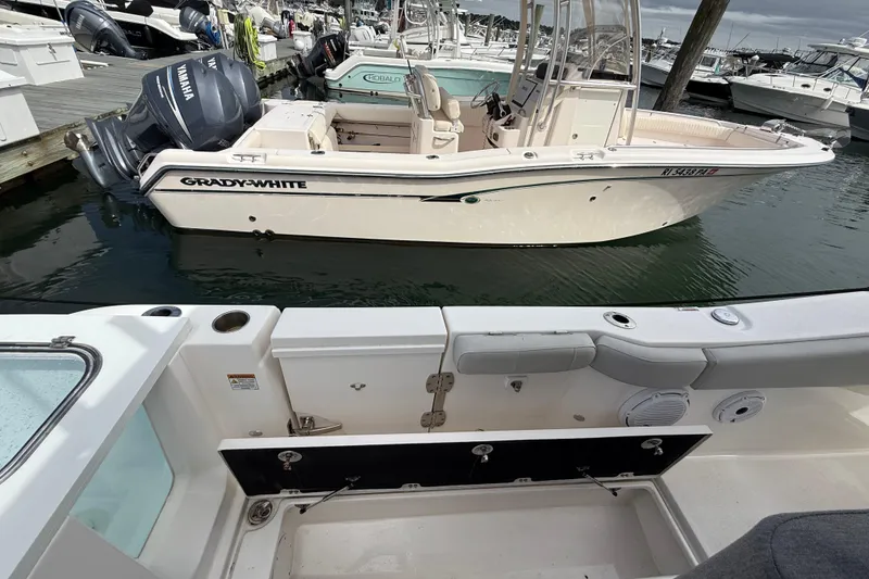 Slide: The Image of 2021 Sea Fox 288 Commander docked, with Grady-White boat nearby in marina. - 13