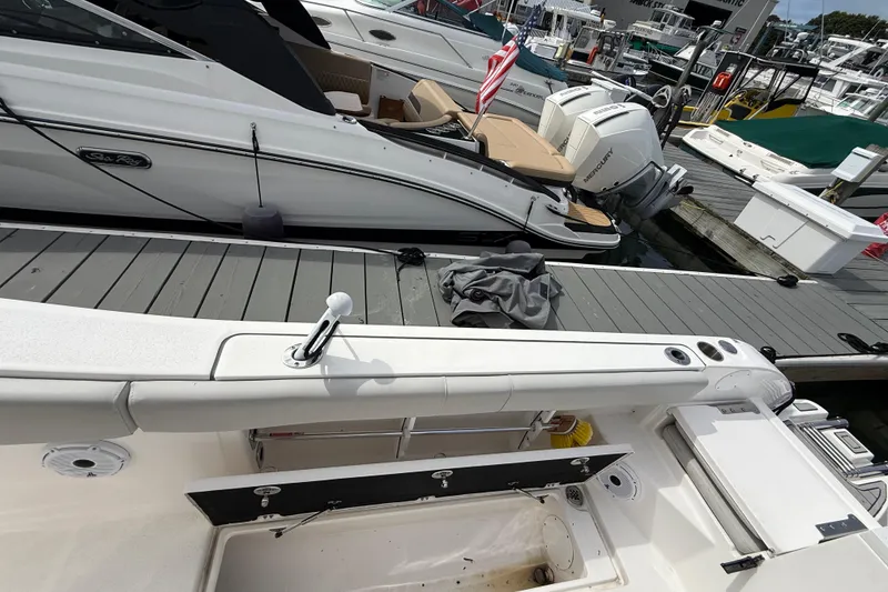 Slide: The Image of 2021 Sea Fox 288 Commander docked, featuring spacious deck and modern design. - 15