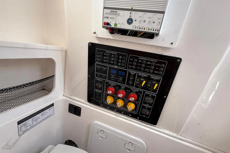 Slide: The Image of Control panel of a 2021 Sea Fox 288 Commander boat, featuring various switches and circuit breakers. - 30