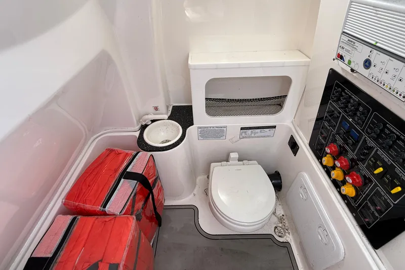 Slide: The Image of Interior of 2021 Sea Fox 288 Commander boat with toilet and control panel. - 31