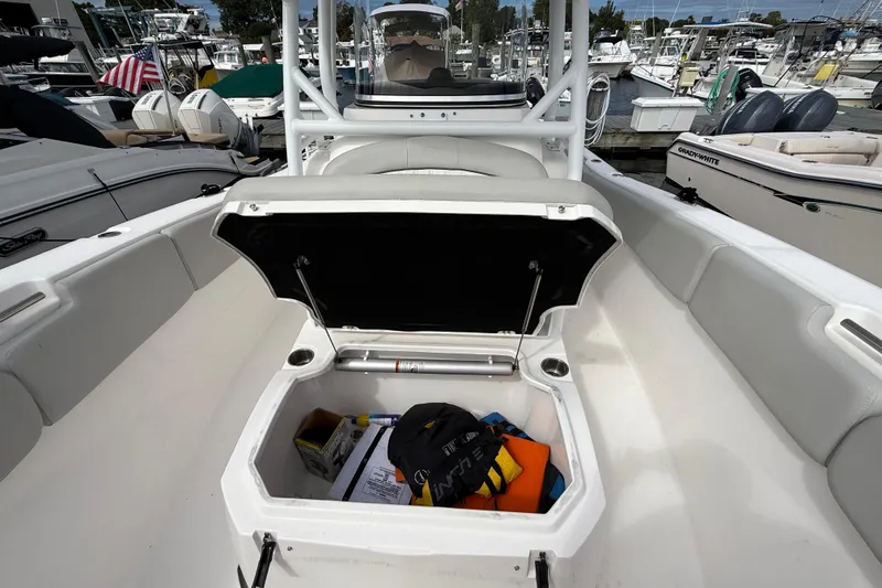 Slide: The Image of 2021 Sea Fox 288 Commander boat with open storage compartment at marina. - 38