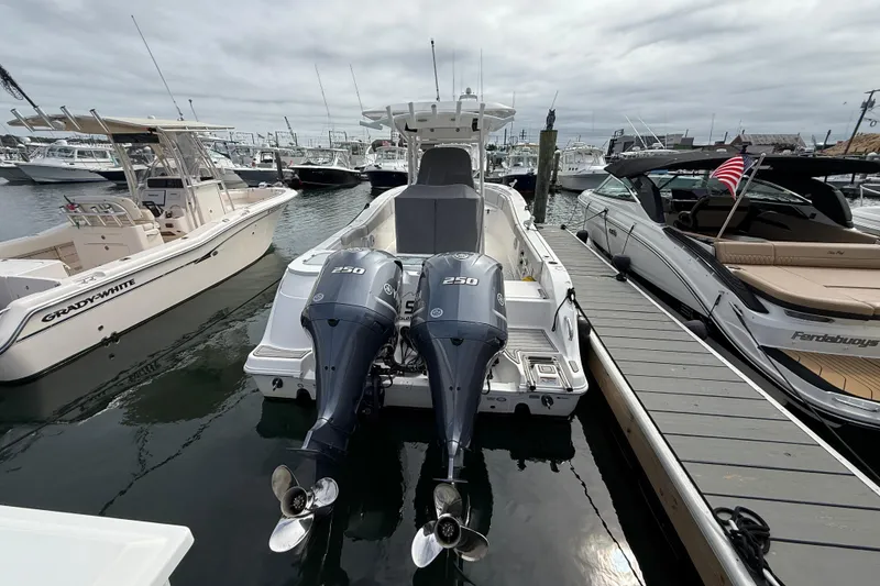 Slide: The Image of 2021 Sea Fox 288 Commander boat docked with twin 250 horsepower engines. - 4